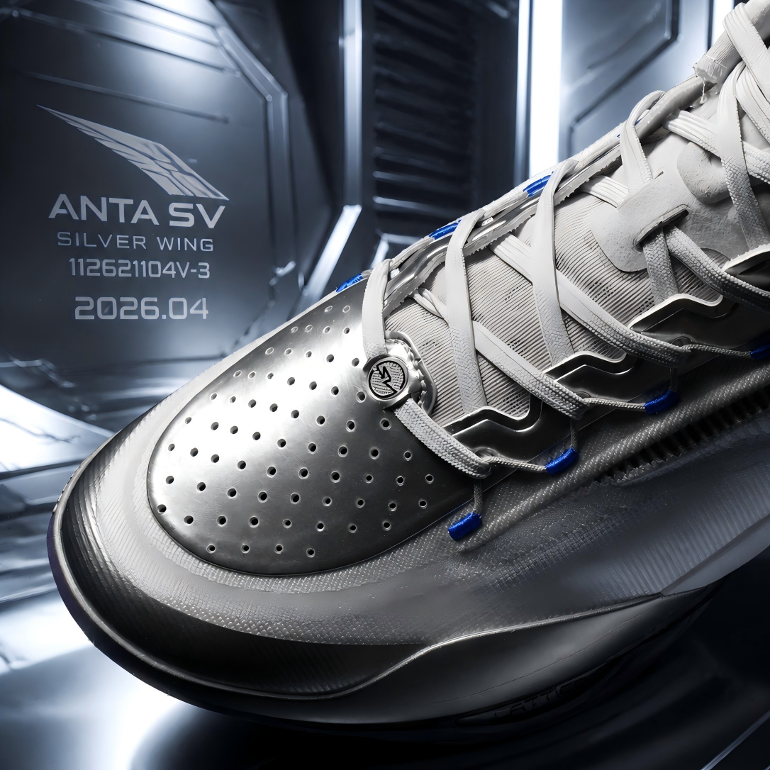 Silver basketball shoe quarter view with perforated forefoot and blue lace eyelets