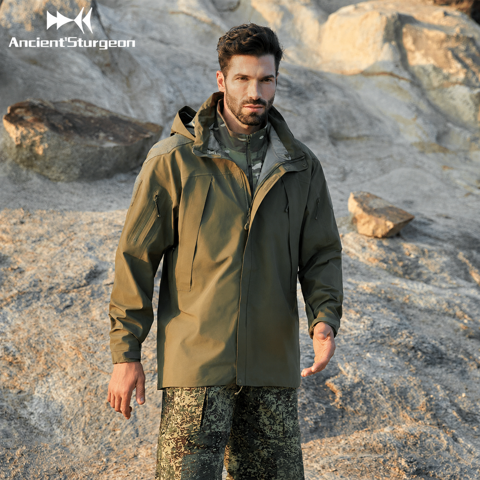 Military green hard shell jacket with adjustable hood, full front zipper, and zip pockets