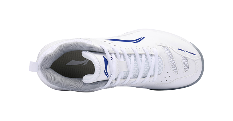 White lace-up badminton shoe with blue logo on side and mesh upper near the collar