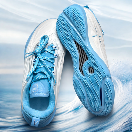 Unisex basketball shoe close-up side and outsole in milky white and light blue.