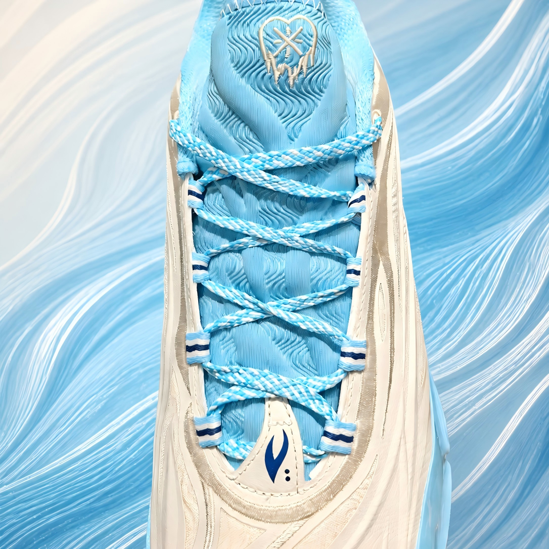 Unisex basketball shoe tongue and lace area in light blue with milky white overlays.