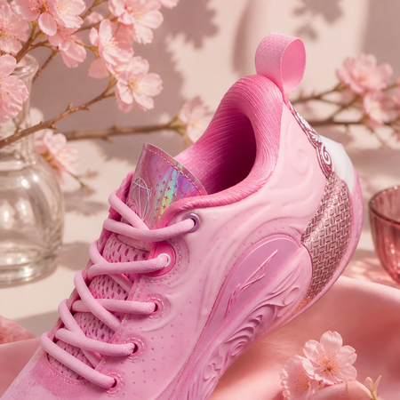 Pink basketball sneaker back and side view with woven heel panel
