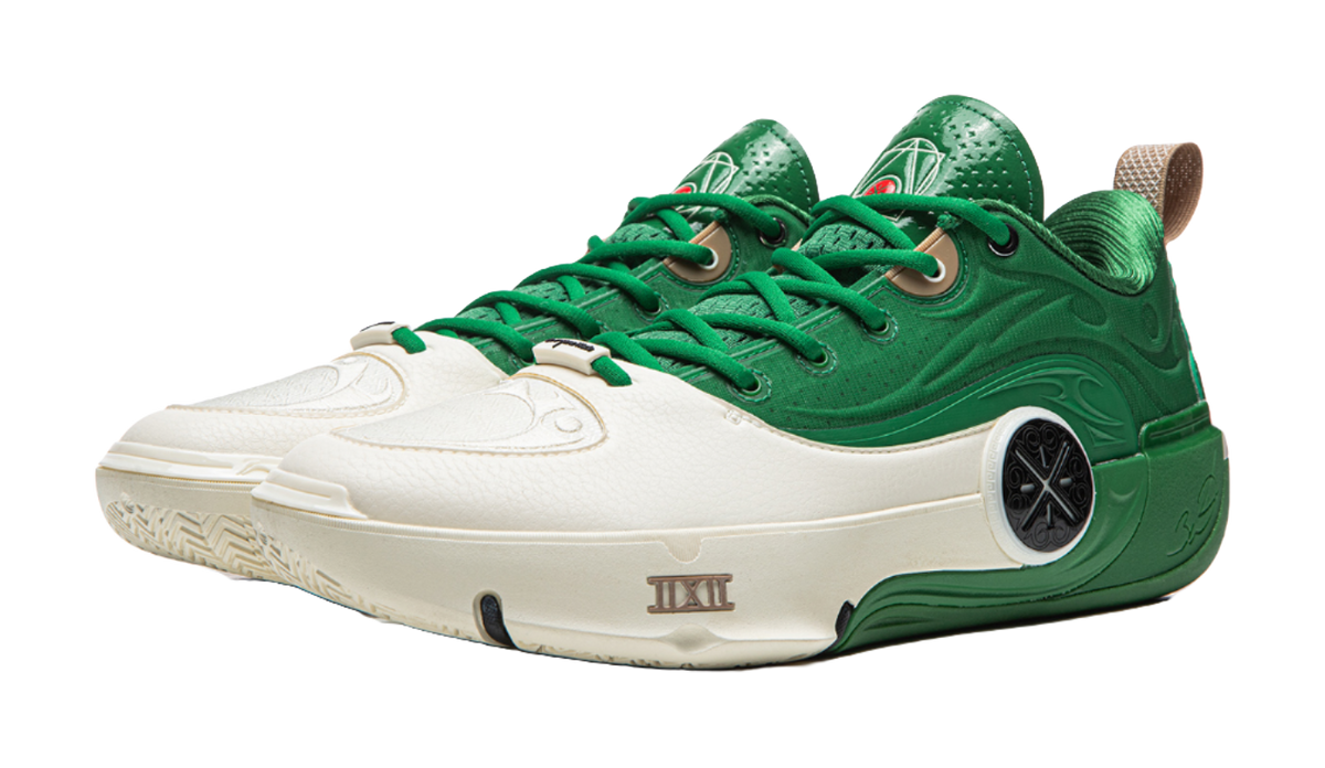 White and green basketball shoes with green laces, side view, textured upper
