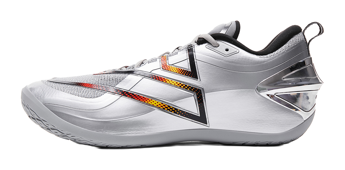 Silver-gray basketball shoe with orange/yellow stripe accents and black collar