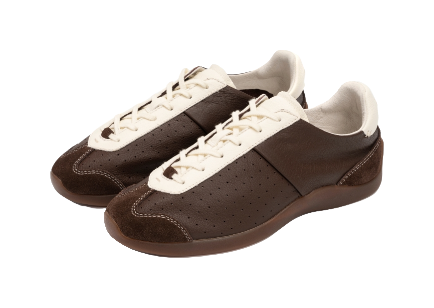 Pair of brown sneakers with antique white laces, perforated sides, and padded collars.