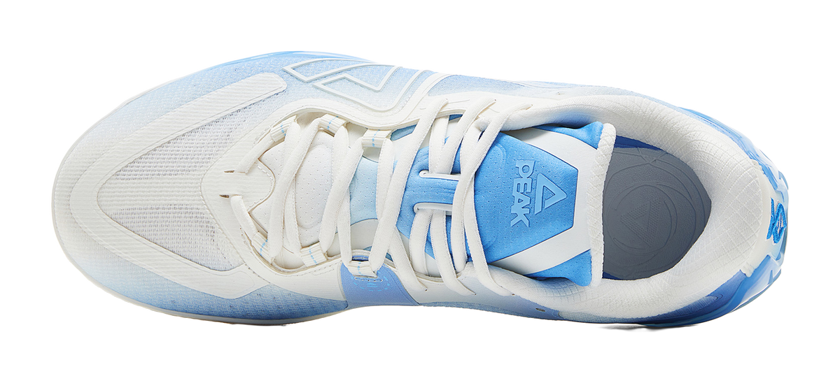 White and blue basketball shoe, heel and outsole view with lace-up collar