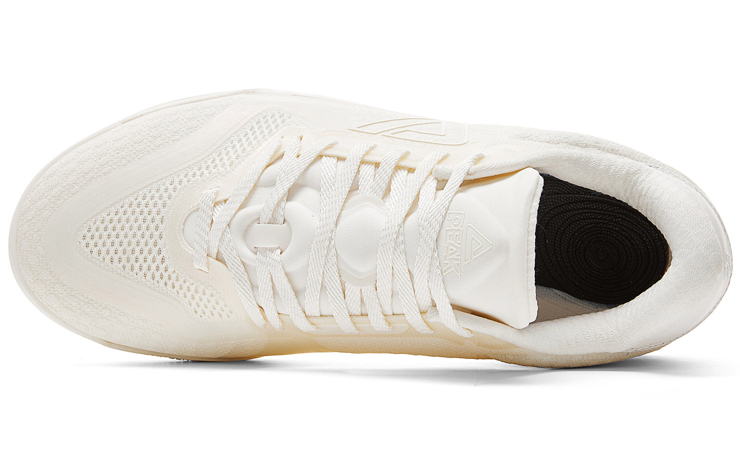 Milky white low-top basketball shoe heel and sock opening detail with lace-up