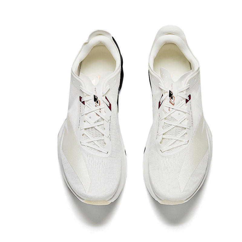 Unisex running shoes in white with lace-up front and red accent logo, top view.