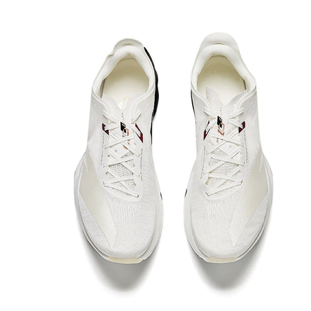 Unisex running shoes in white with lace-up front and red accent logo, top view.