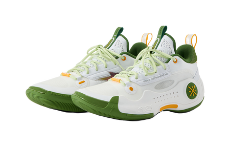 White low-top basketball shoes with green heel collar, light green laces, and orange details.