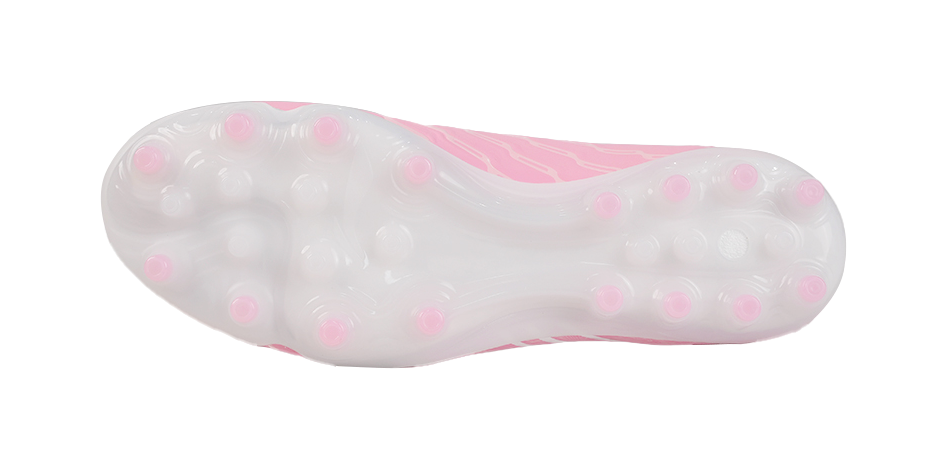 Pink soccer cleat outsole with translucent base and round conical studs