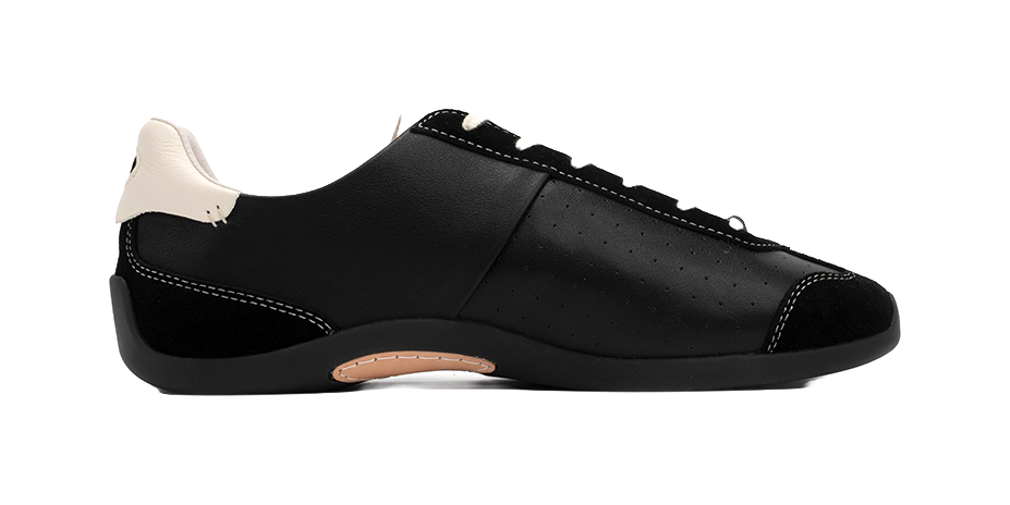 Black low-top trainers with perforations, lace-up closure, cream collar lining