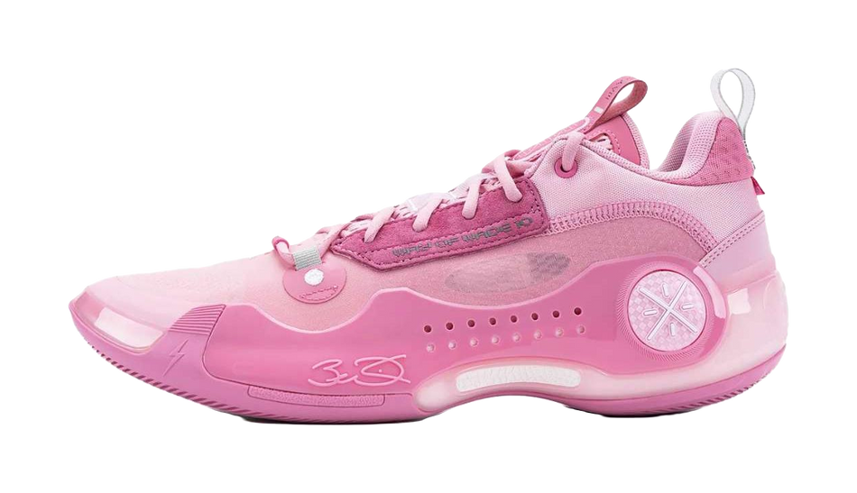 Pink low-top basketball shoe with lace-up, padded collar and circular logo detail