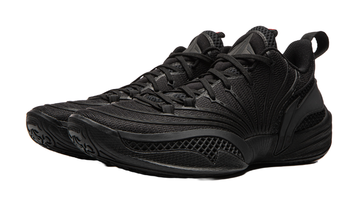 Black basketball shoe angled view with textured side panels and lace-up front