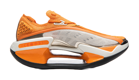 Orange and white Li-Ning Shadow running shoe with perforated upper and visible cushioning window