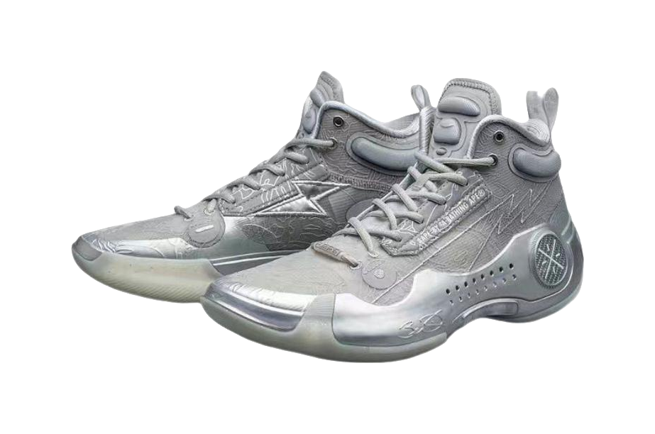Gray mid-top basketball shoes with lace-up closure, padded collar, and circular logo on heel.