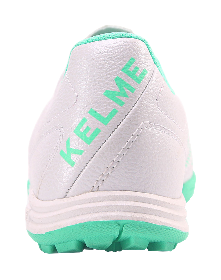 Kelme TF training soccer shoes, heel with KELME logo and mint green trim.