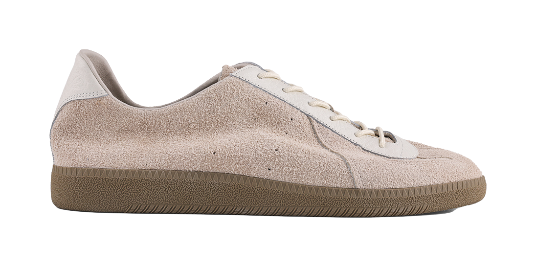 Khaki suede low-top sneaker with white lace-up panel and grippy rubber edge