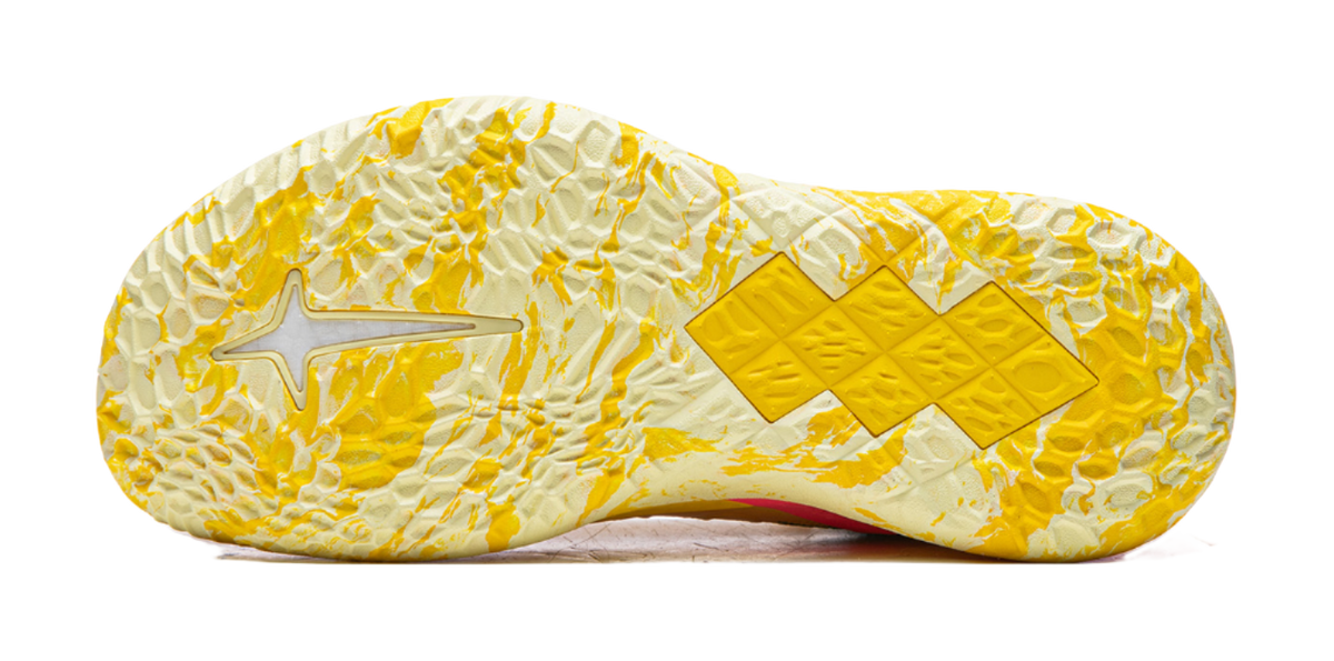 Lemon yellow basketball shoe outsole with textured tread and star-pattern traction pods