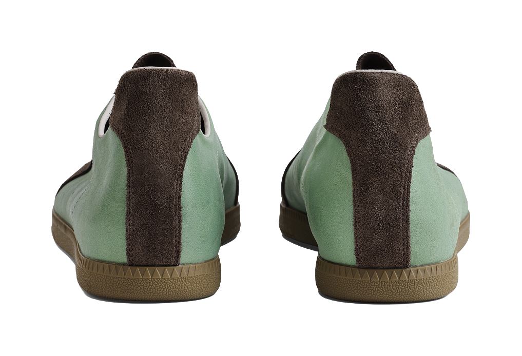 Mint and brown training shoes from heel view with cushioned back panel
