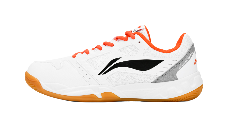White and orange badminton shoe with black logo and orange laces