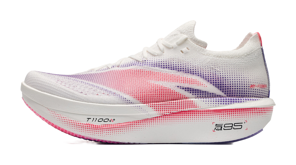 Purple low-cut running sneaker with red and blue stripe pattern, knit upper
