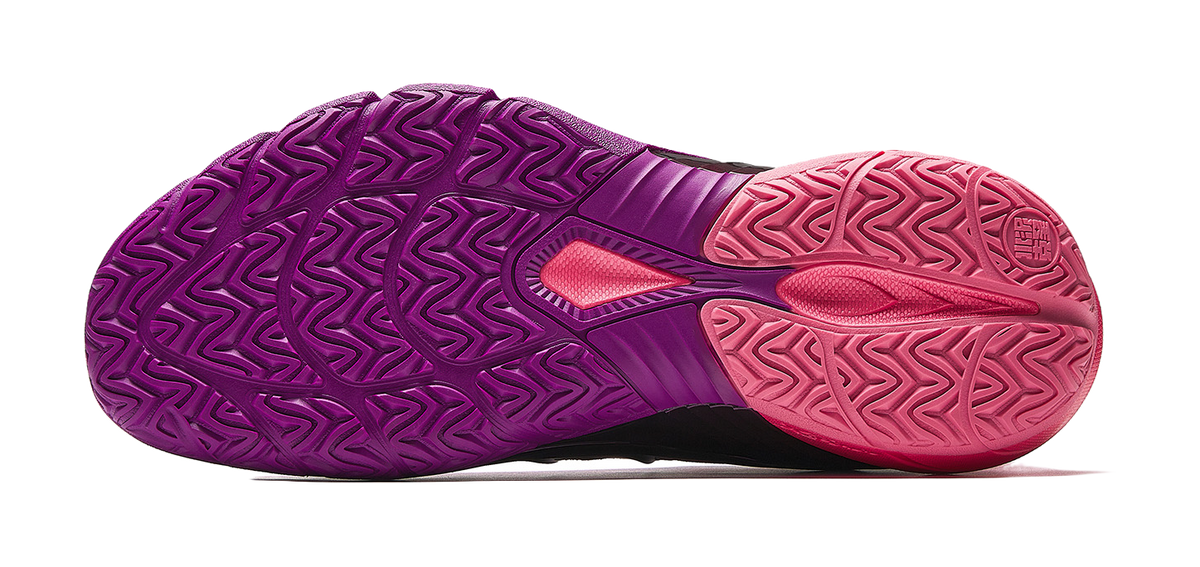 Low-top basketball shoes outsole view; purple tread with pink forefoot and heel.
