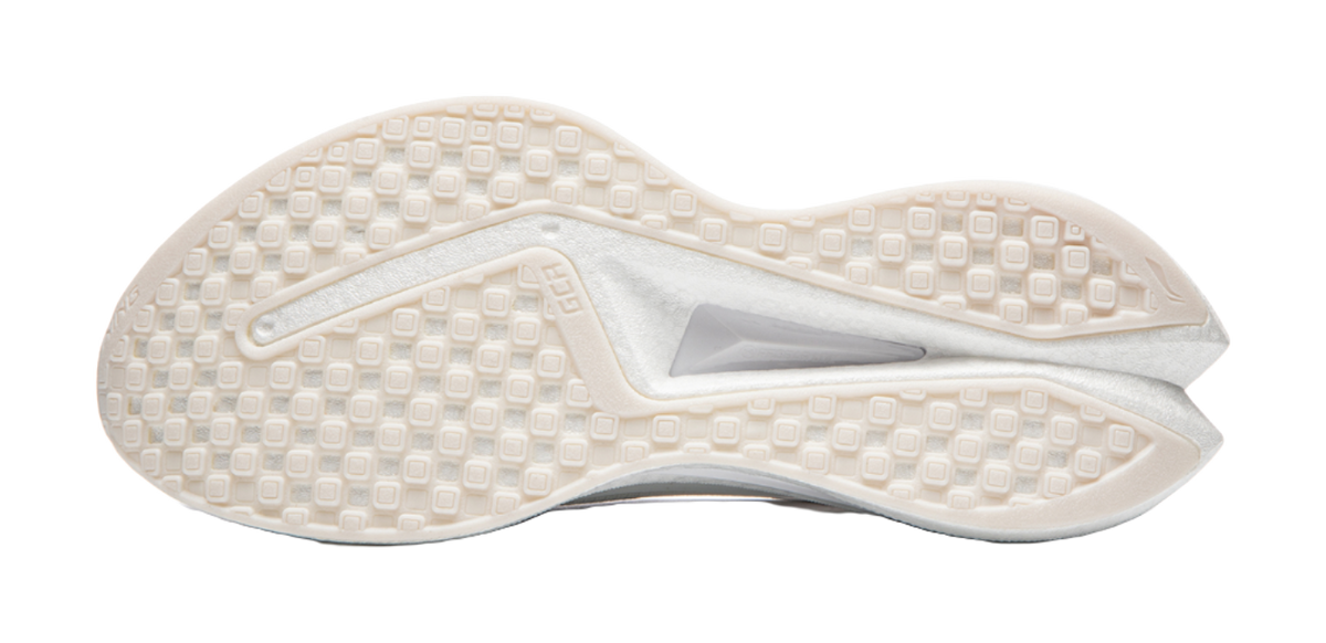 White shoe outsole with patterned traction tread and molded heel cup