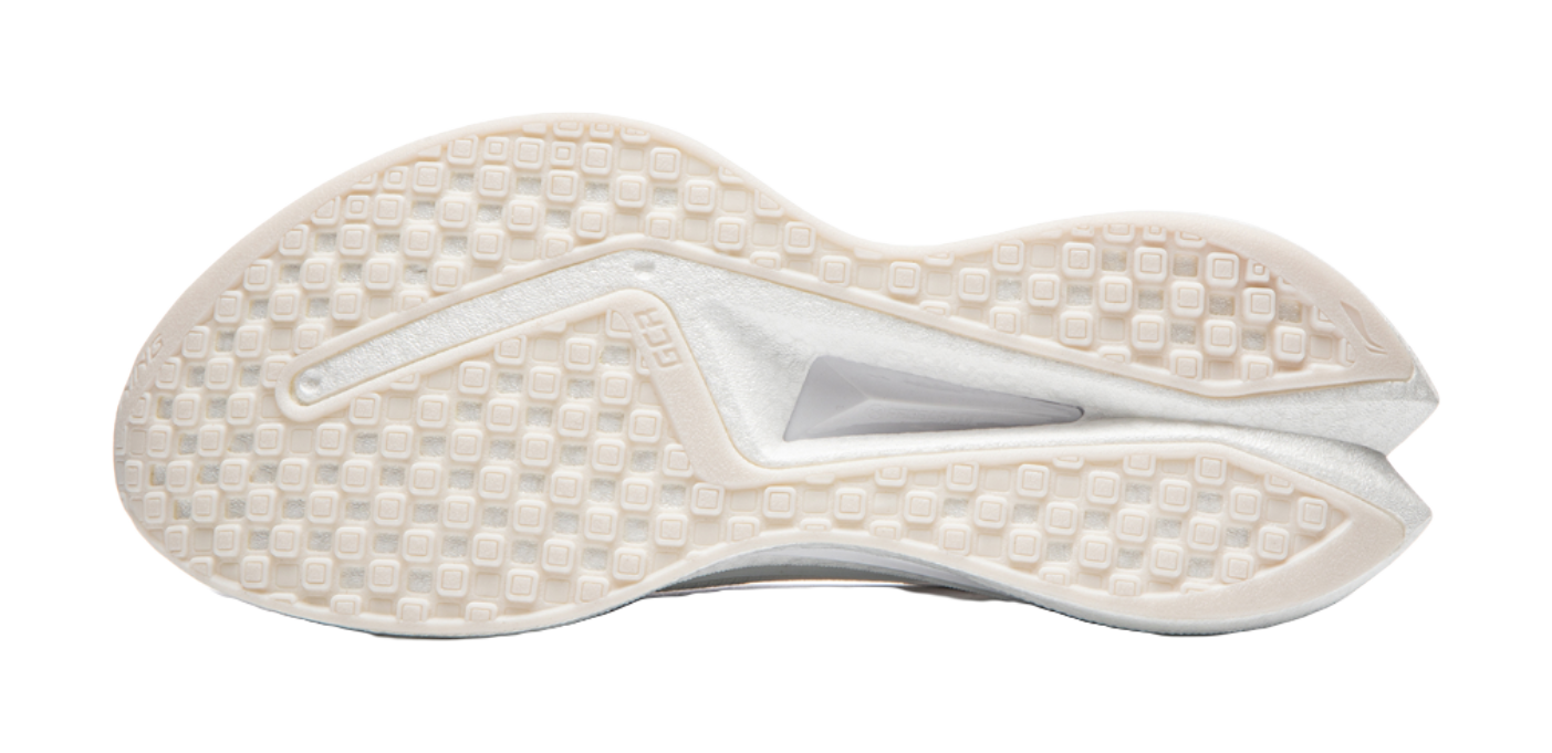 White shoe outsole with patterned traction tread and molded heel cup