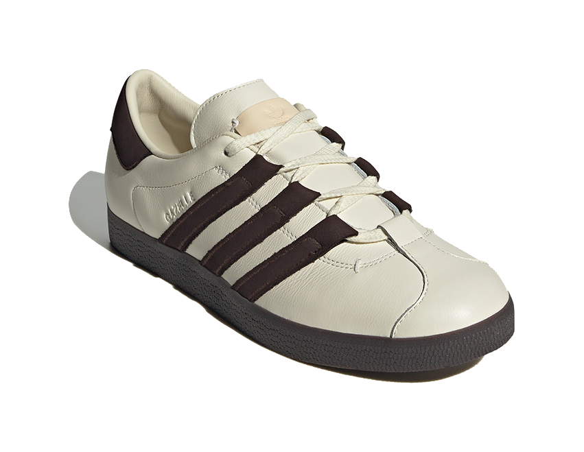Unisex low-top skate shoes, cream upper with dark brown stripe detail and laces