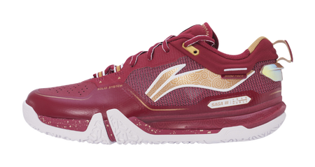 Red badminton shoe with mesh upper, gold accents, white outsole, and lace-up front.