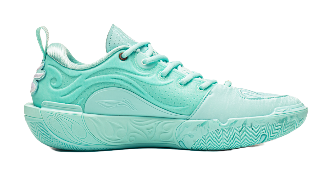 Light teal low-top basketball shoes, side view with textured midsole and lace-up