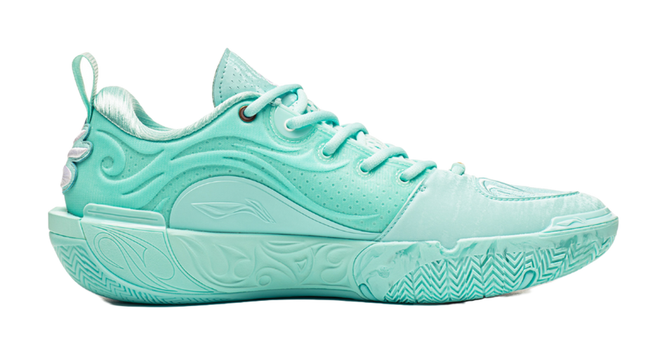 Light teal low-top basketball shoes, side view with textured midsole and lace-up