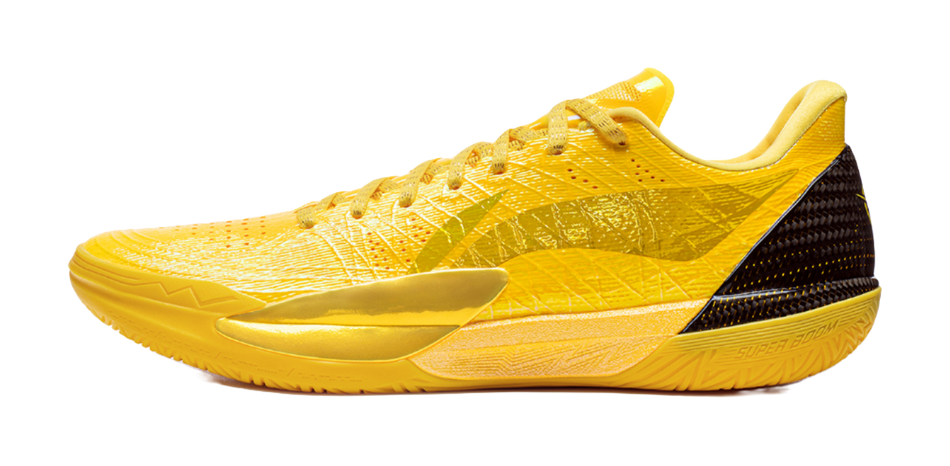 Li-Ning low basketball shoe in yellow, side view with lacing and textured upper