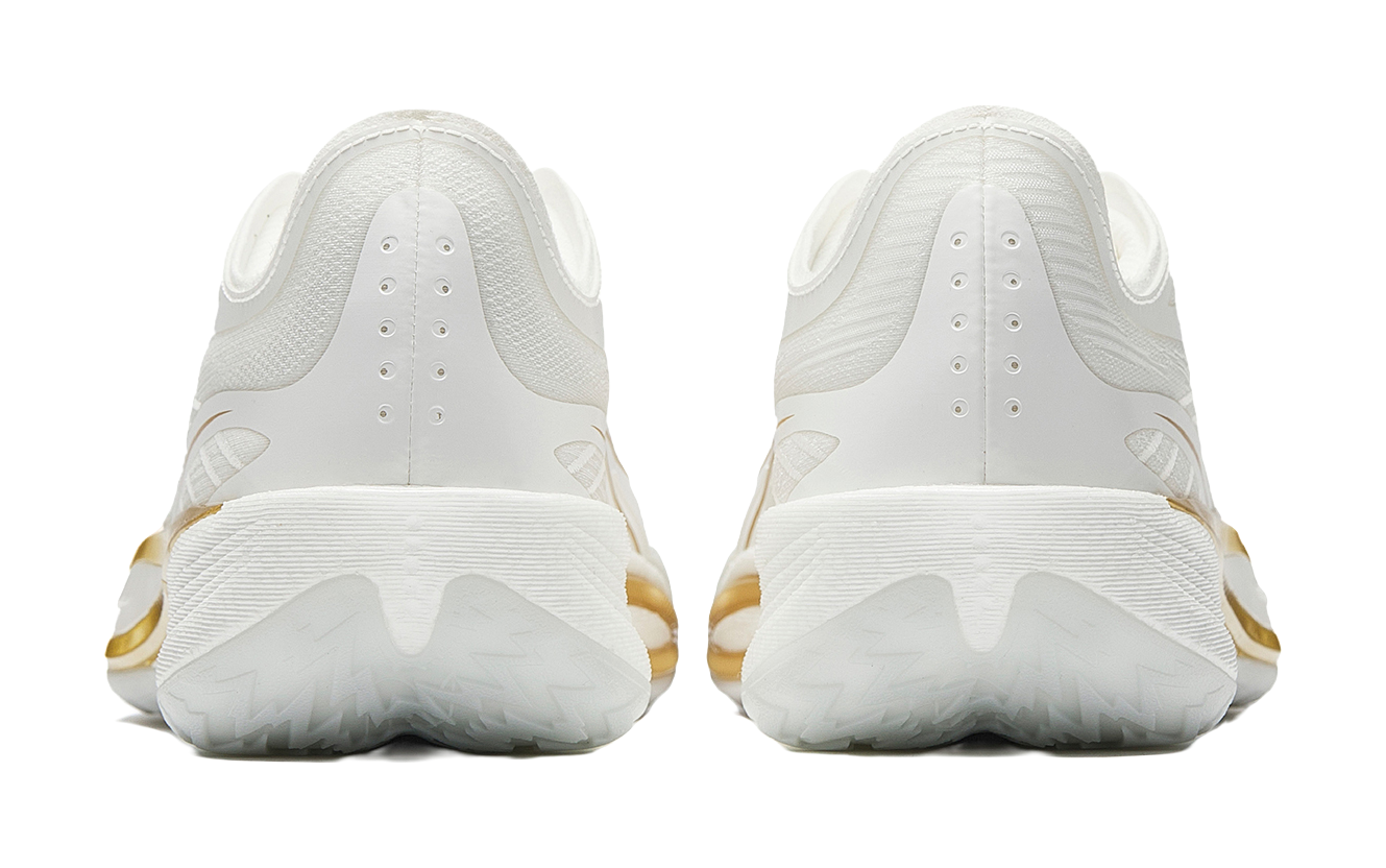 Pair of men's white low-top basketball shoes, rear view with gold heel accents