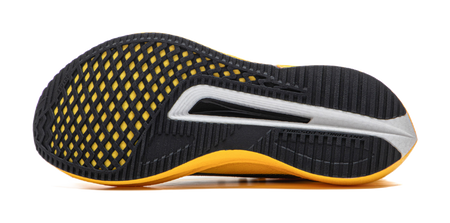 Black and yellow low-top running shoe outsole side view with textured grip pattern.