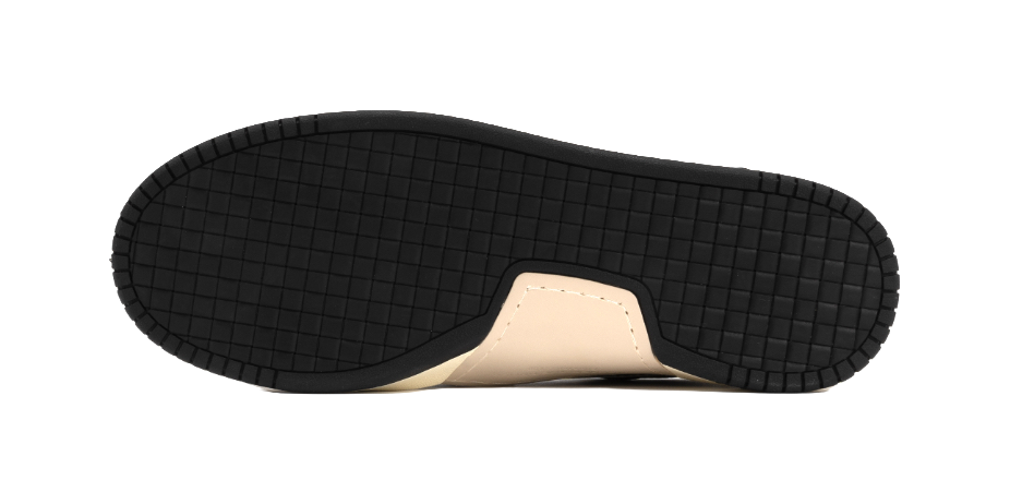 Black rubber outsole for skate shoes with curved grid tread pattern