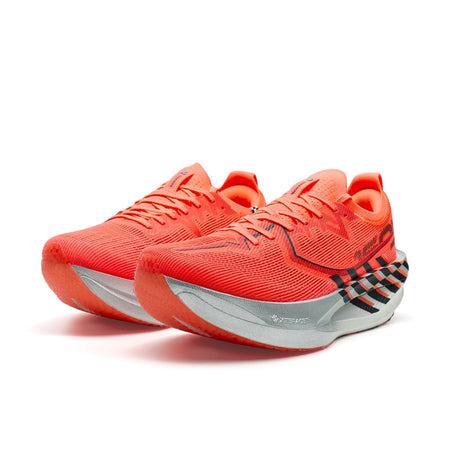 Pair of marathon racing shoes in orange with laces and black-and-gray stripe accents