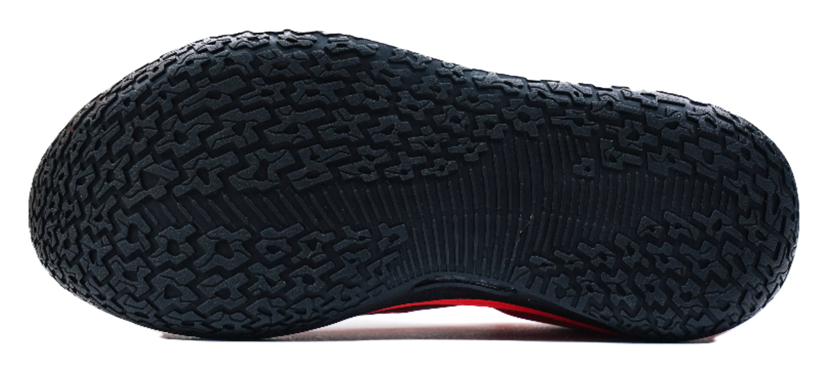 Black rubber outsole with raised tread pattern for low-top basketball shoes