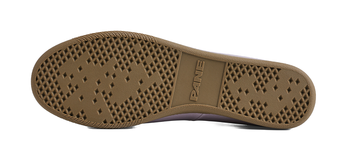 Rubber outsole with diamond tread pattern on lavender low-top shoes for slip resistance