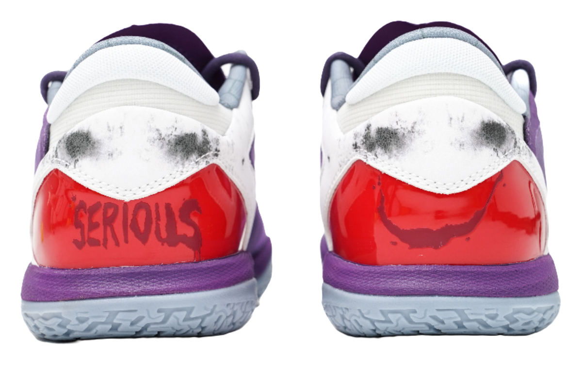Purple basketball shoes with white heel collar and glossy red heel patch