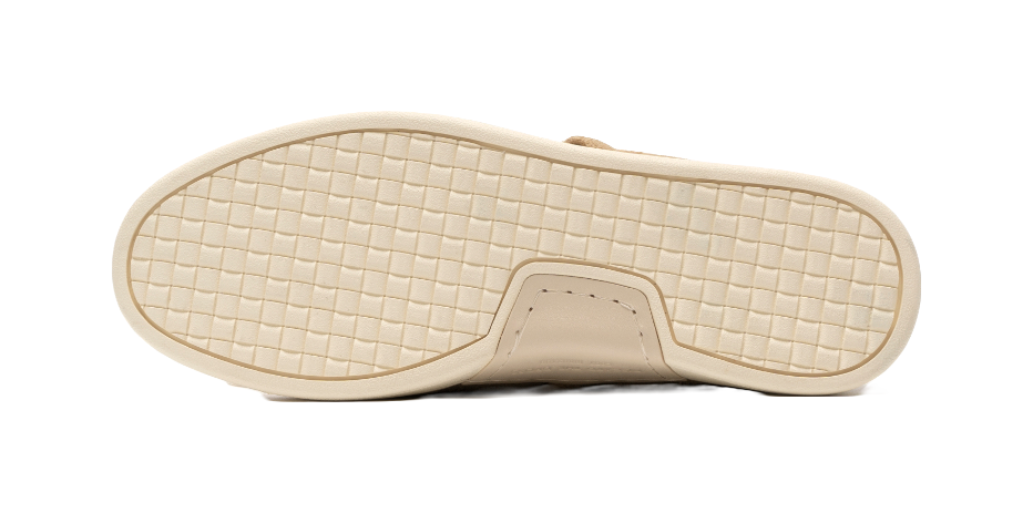 Light beige rubber outsole with grid tread and stitched toe bumper
