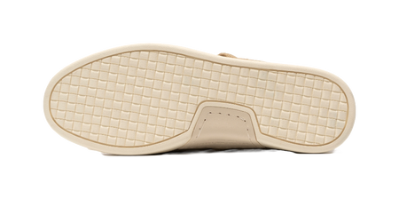 Light beige rubber outsole with grid tread and stitched toe bumper