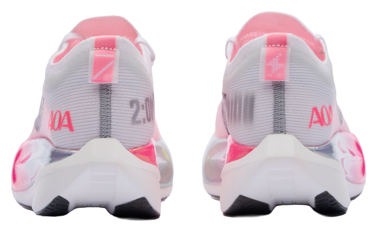 White and pink low running shoes from heel view with AOA branding and cushioned sole