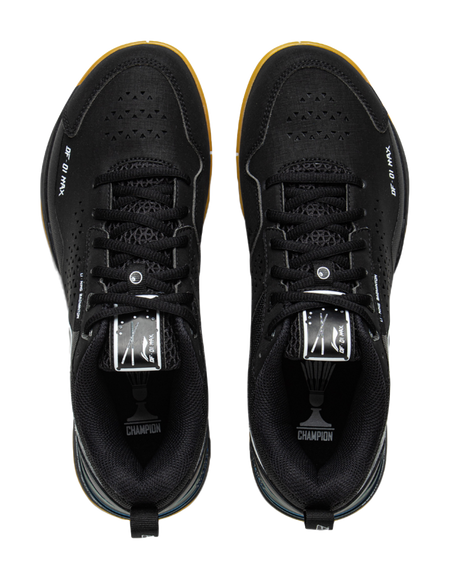 Black badminton shoe front view with lace-up closure, perforated toe, and tongue graphic.