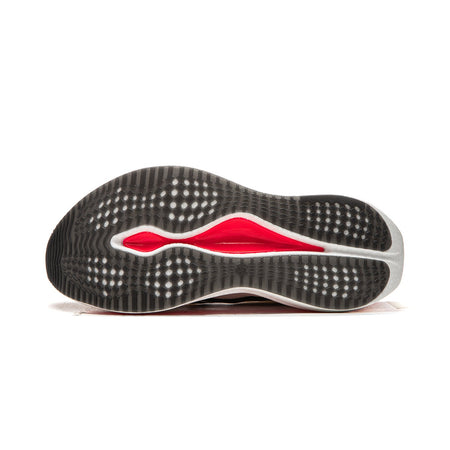 Running shoe outsole with black traction texture, red and white lines, underside