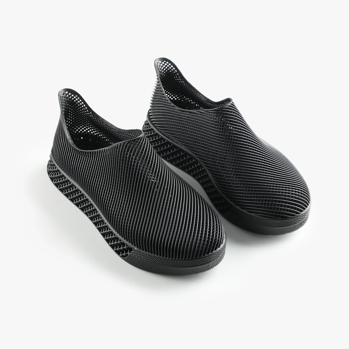 3D printed slip-on sneakers, dark black pair with ribbed knit texture