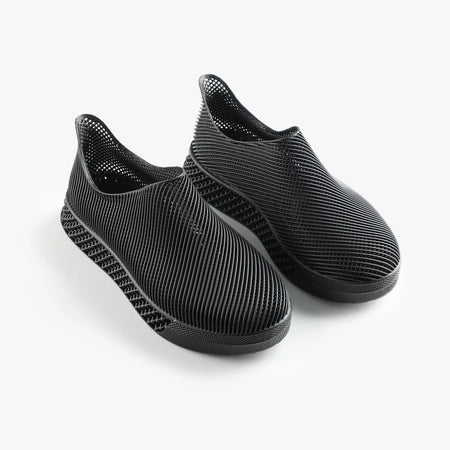 3D printed slip-on sneakers, dark black pair with ribbed knit texture