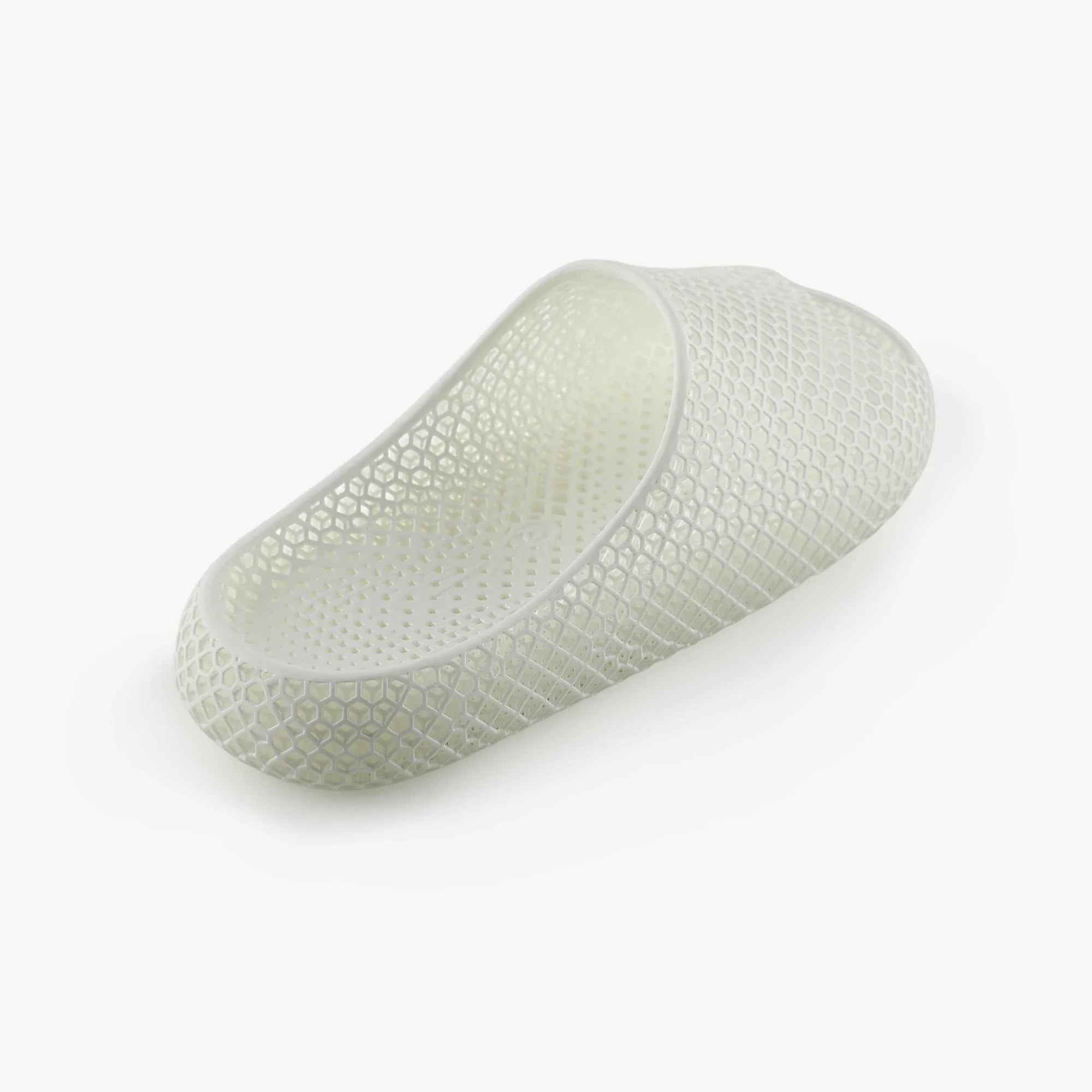 3D printed slippers, white side profile with textured strap and oval toe opening