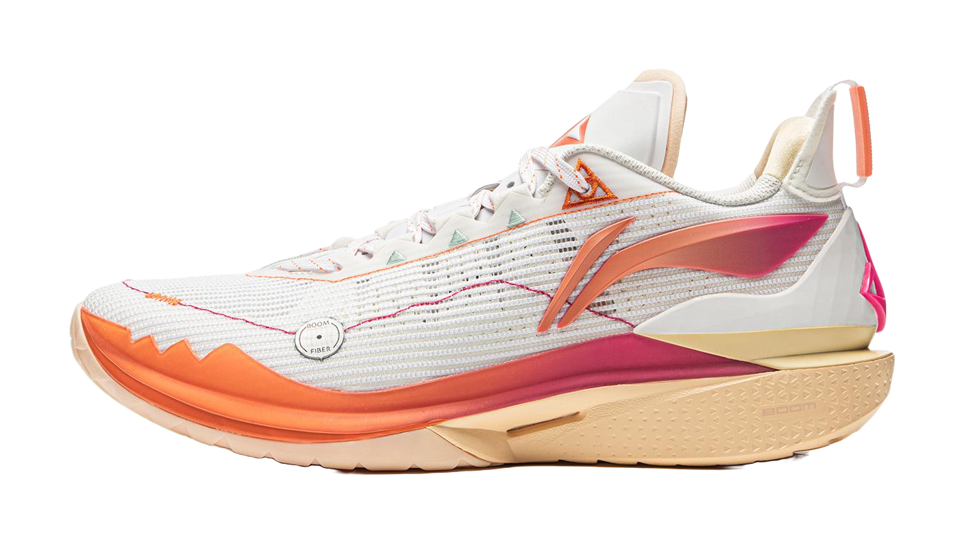 White basketball shoe with orange trim, mesh upper, and beige outsole